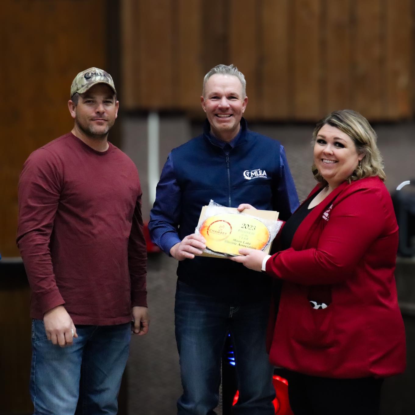 Emma Baker, Director of the Rangely Chamber, Presenting an Award to Moon Lake Electric